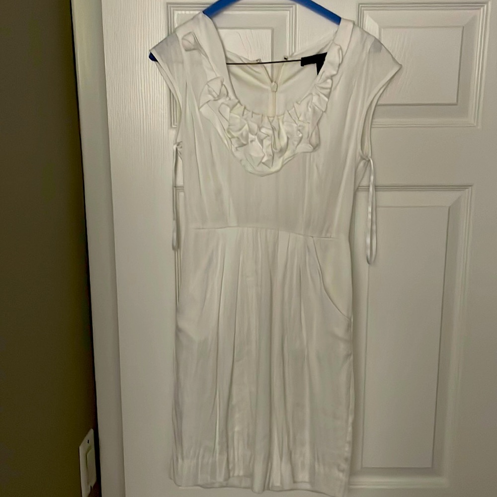 This is a cocktail or a work dress.  It has pockets in he front.